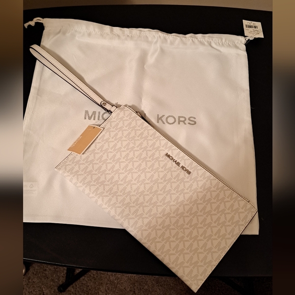 Michael Kors Jet Set Travel wrislet NWT with NWT Michael Kors Dust bag